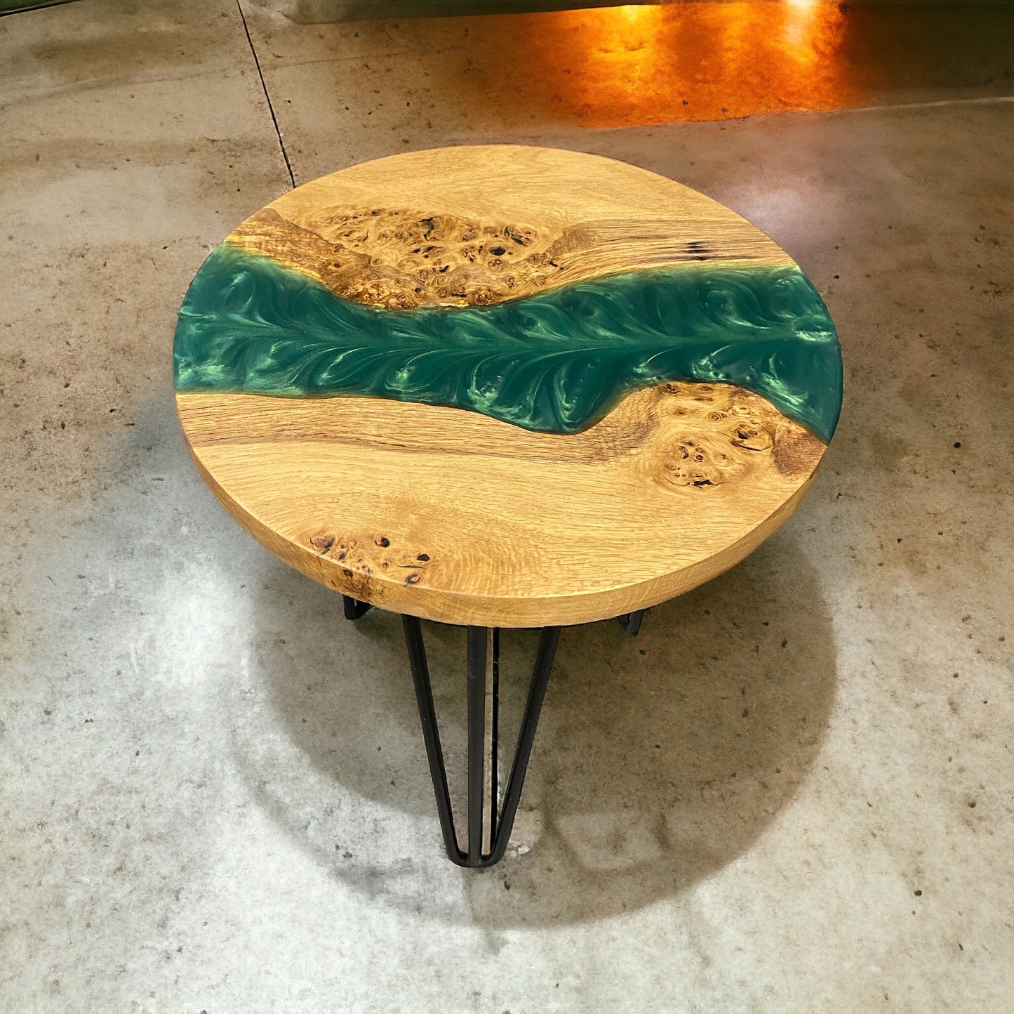 Oak and forest green resin end table with black hairpin legs, blending rustic charm with a modern aesthetic.