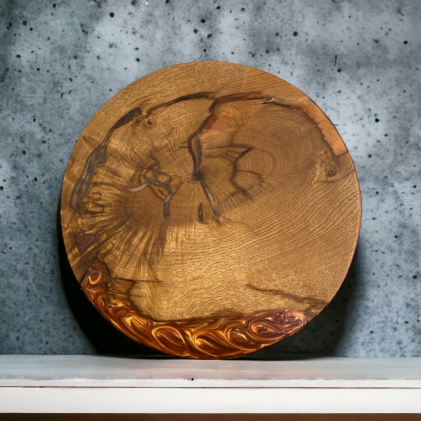 a round oak and copper resin disk that can be used as a table top, clock face or centrepiece. the resin features a flowing swirl pattern.