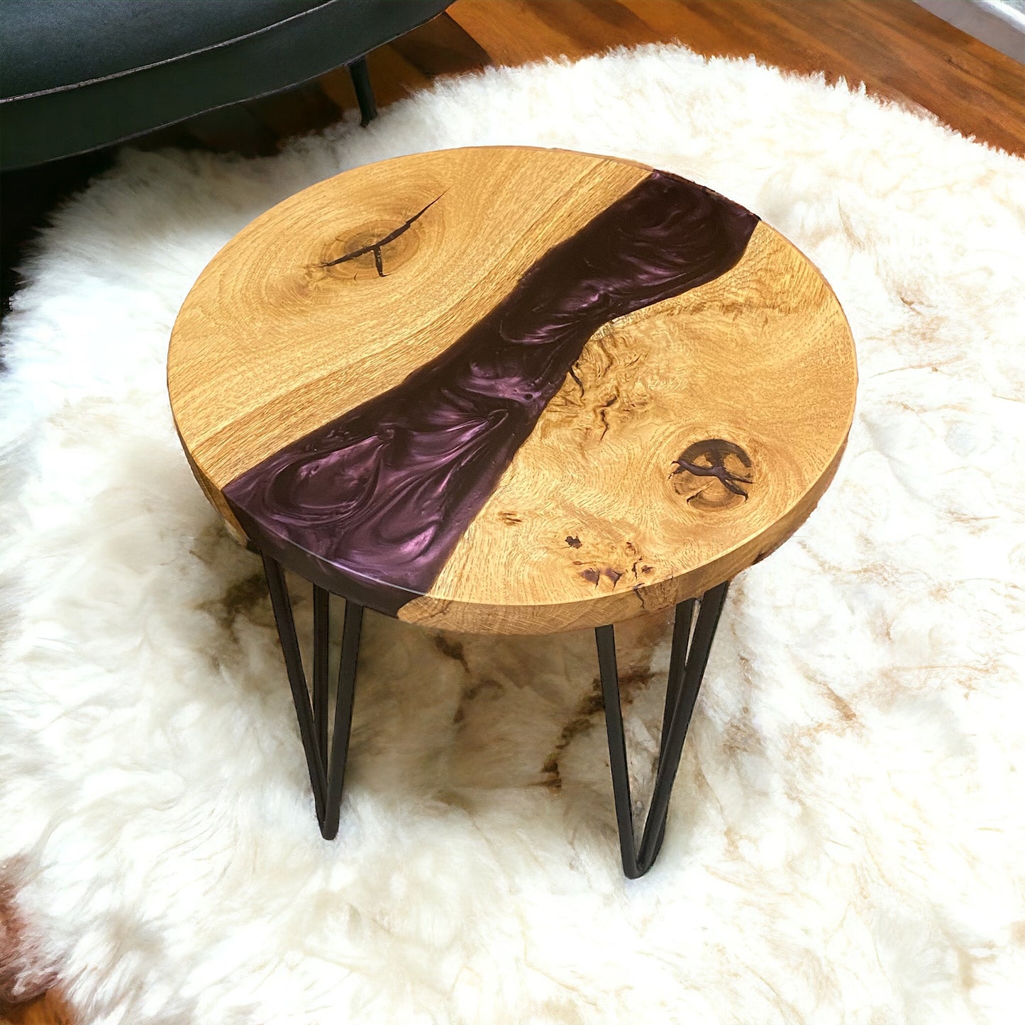 Left-side view of the round end table, emphasizing the rich purple epoxy detailing and solid oak craftsmanship.