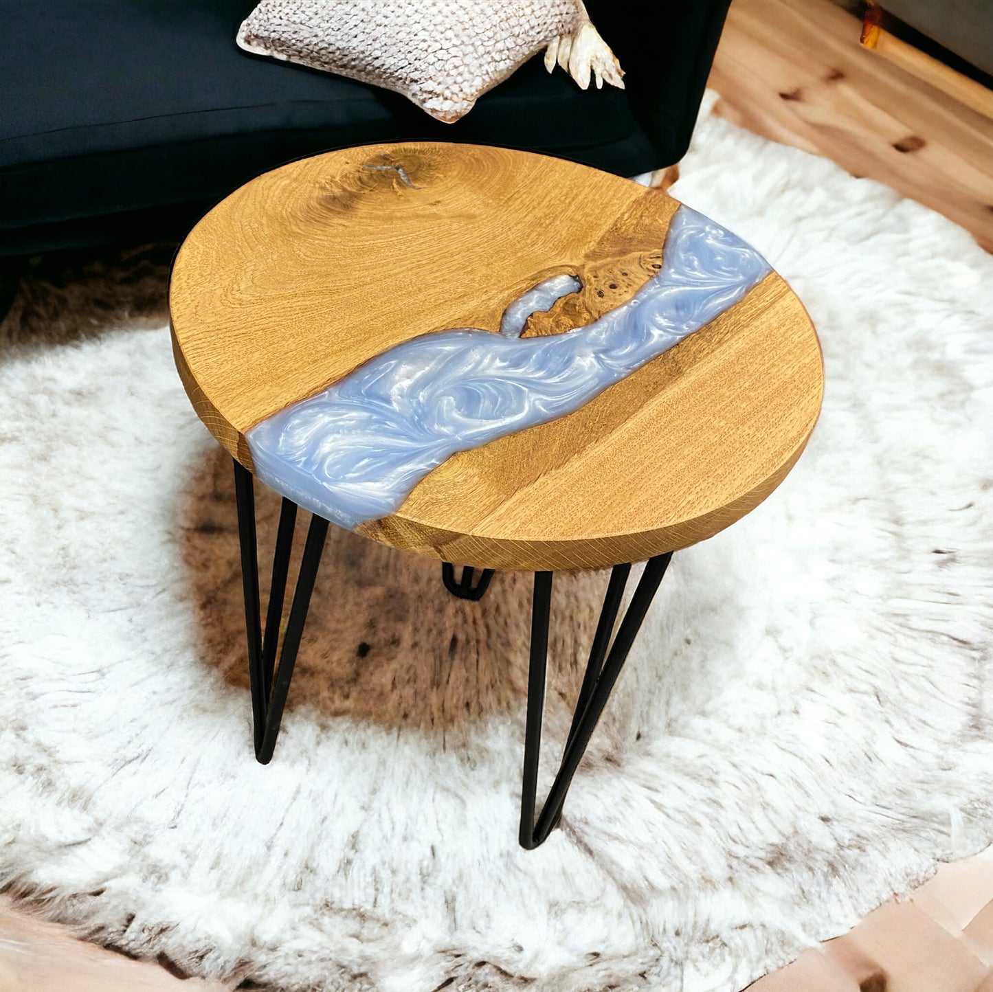 A left-side perspective of the round oak and resin end table, displaying the seamless integration of wood and epoxy.