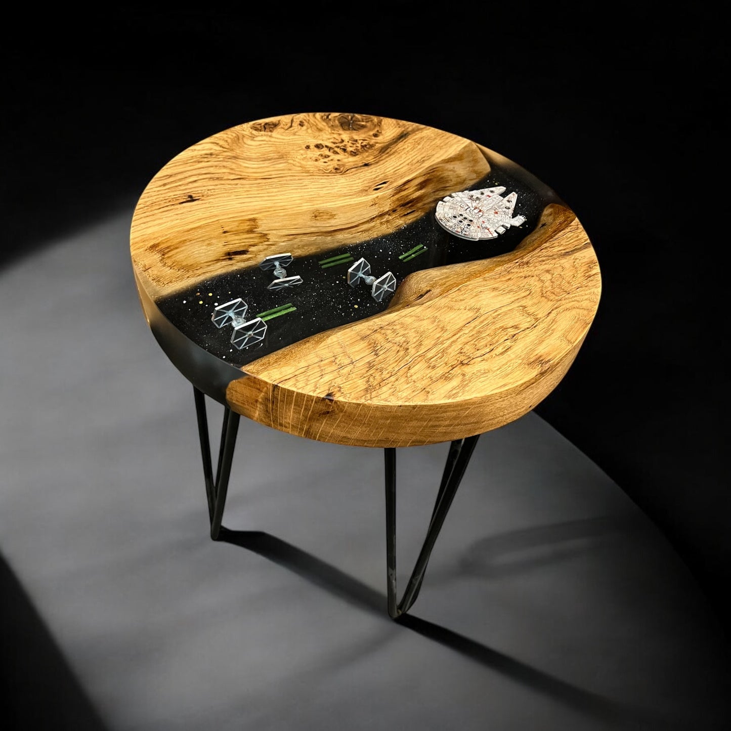 Side angle of the oak and epoxy resin end table, highlighting the natural wood grain and contrasting deep-space-inspired resin.