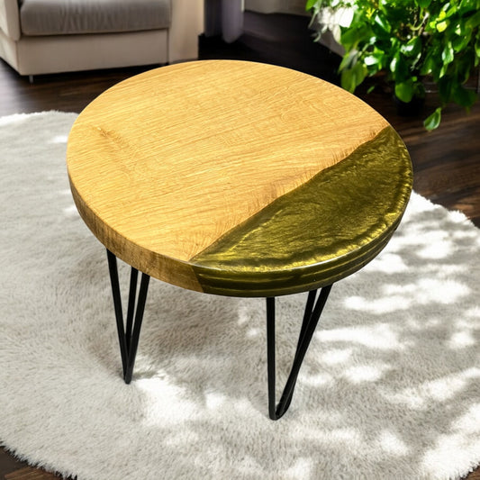 A side angle showcasing the seamless blend of solid oak and front edge shimmering olive gold resin, highlighting the table's smooth finish.