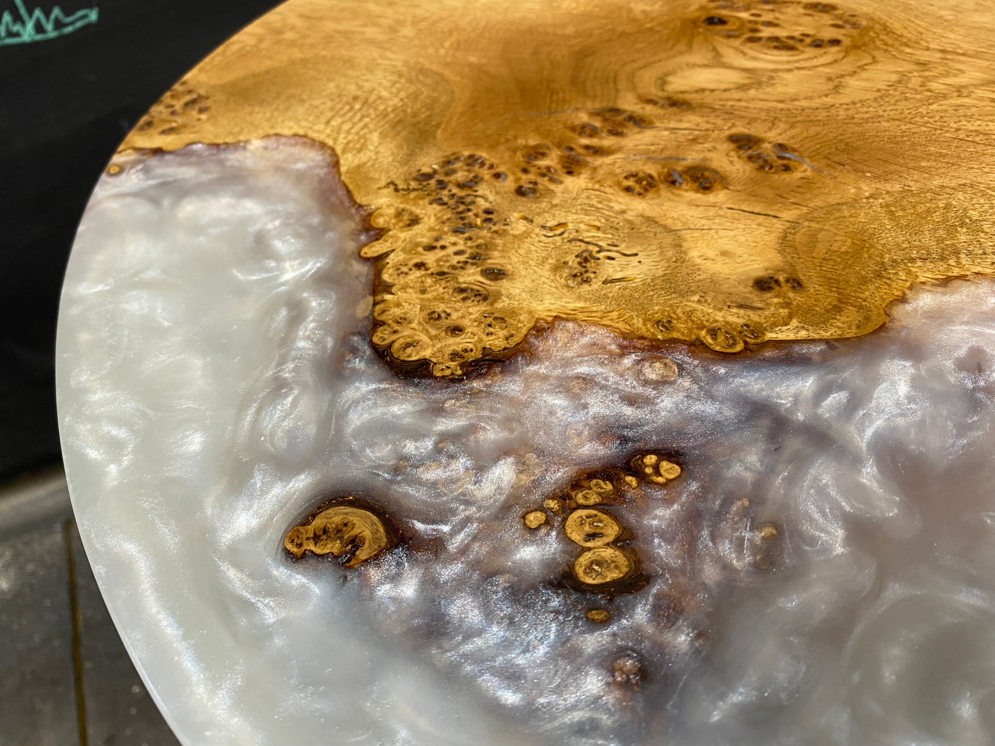 a character piece of oak with white shimmery resin