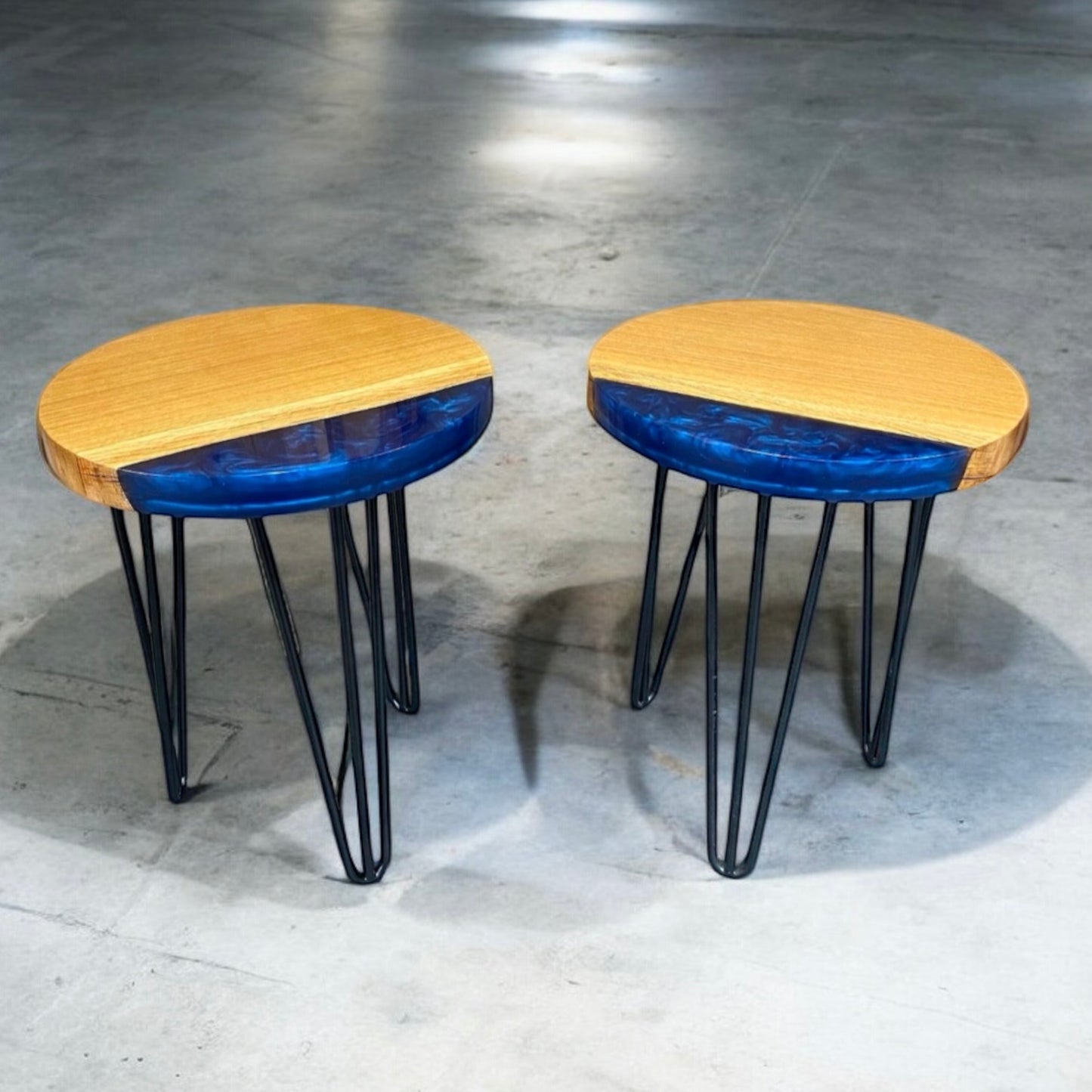 A pair of matching oak and epoxy resin end table placed in a modern home setting, demonstrating its stylish and functional design.