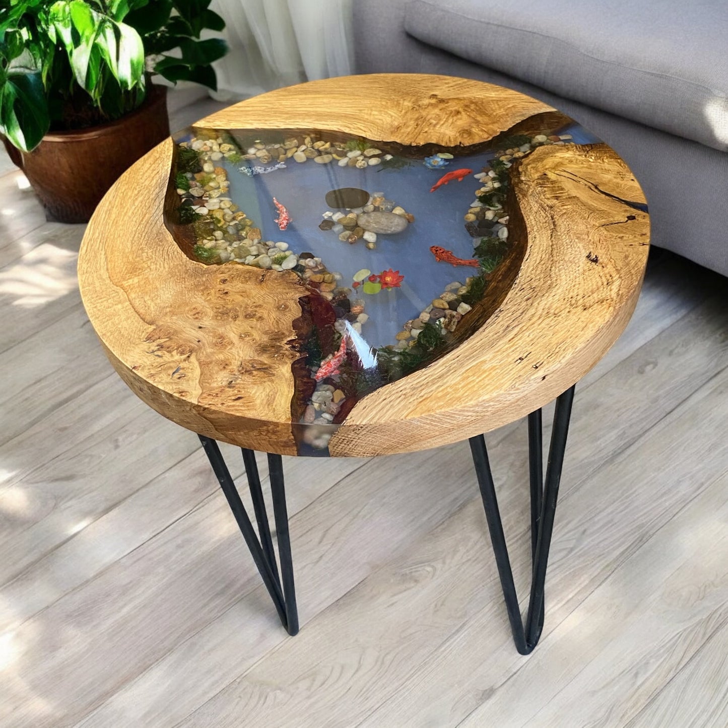 Side view showcasing the table’s sturdy steel legs and the smooth resin finish.