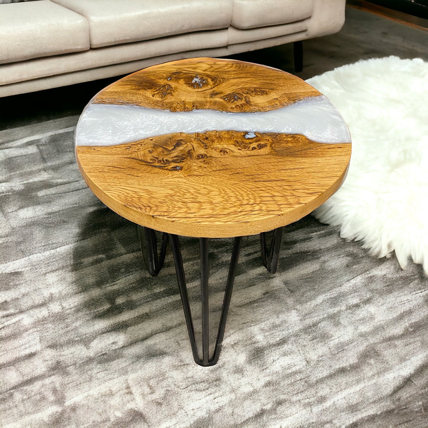 A front-facing image of the dark oak and snow-white epoxy resin end table, supported by sleek black hairpin legs for a modern touch.