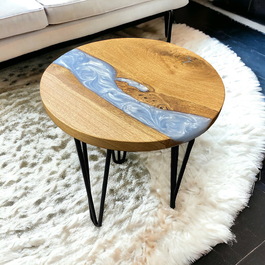 A right-side angle of the oak and epoxy resin end table, highlighting the blend of warm oak tones with the soft baby blue resin.