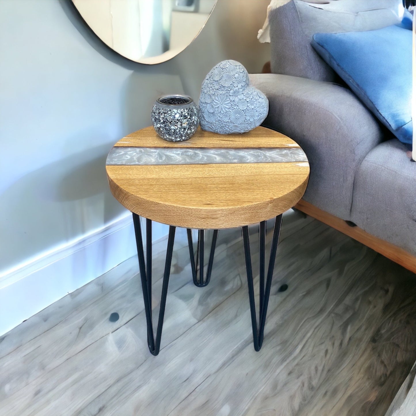 A stylish oak and resin end table with a smooth pearl white epoxy river, creating a timeless and sophisticated look.