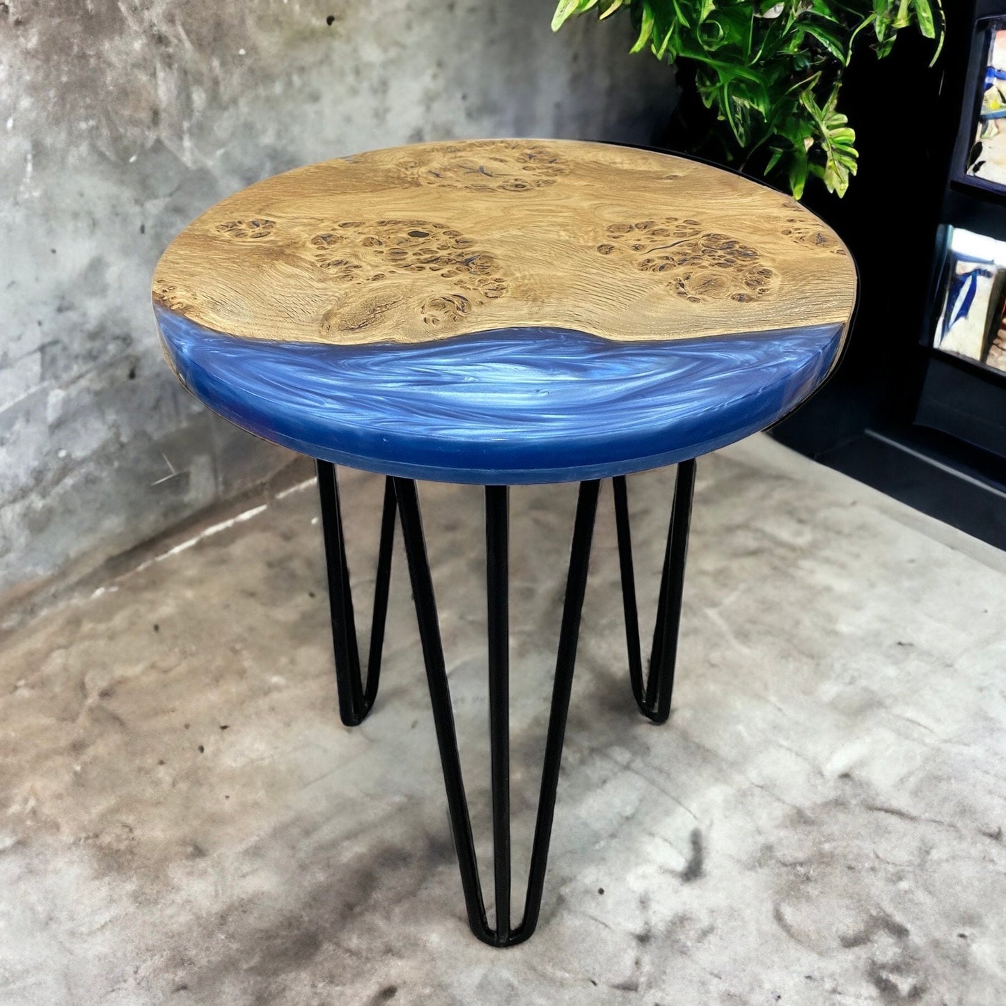 Front-facing view of the denim blue resin and oak end table, showcasing its sleek hairpin legs and modern aesthetic.