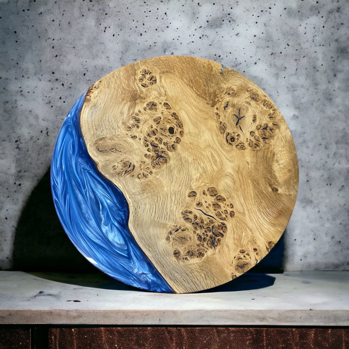 a character oak and blue resin circle that can be used for a table top, clock face or centrepiece, the resin features a swirling pattern