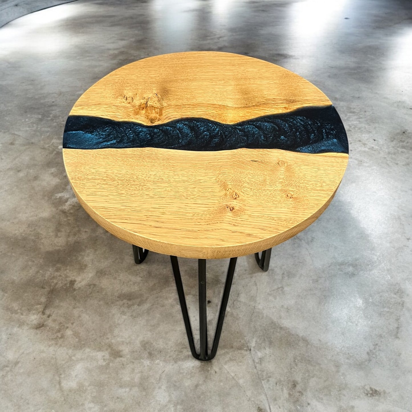 Front view of the oak and epoxy resin end table, showcasing its celestial blue resin design and sturdy wooden legs